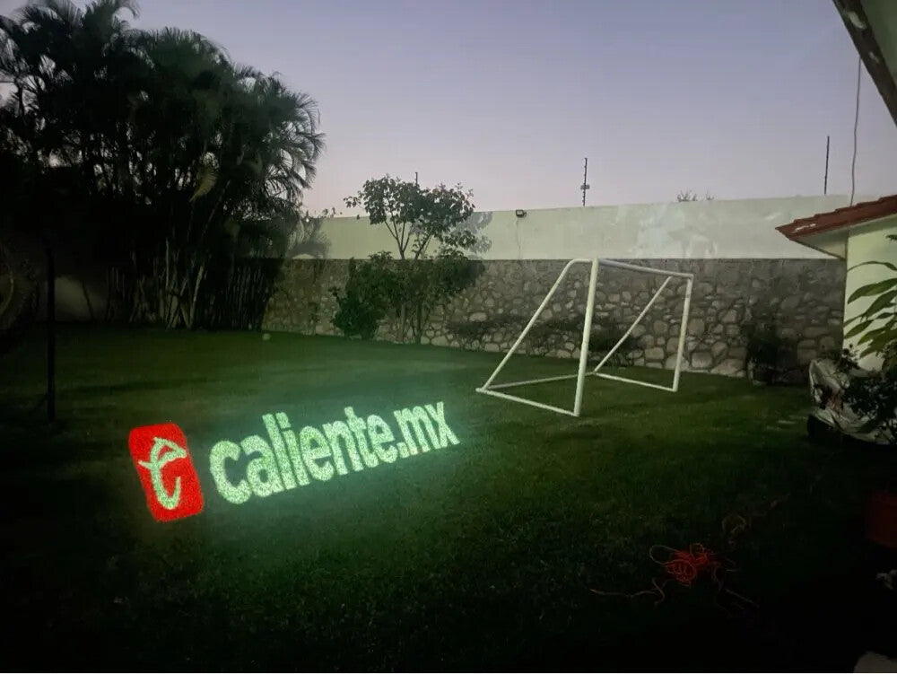 The wonderful effect of logo projector on the grass